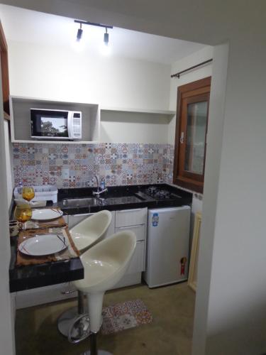 Η κουζίνα ή μικρή κουζίνα στο Casa com piscina e incrível vista para lagoa