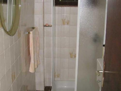 a shower with a glass door in a bathroom at Apartment Pasman 1 in Pašman