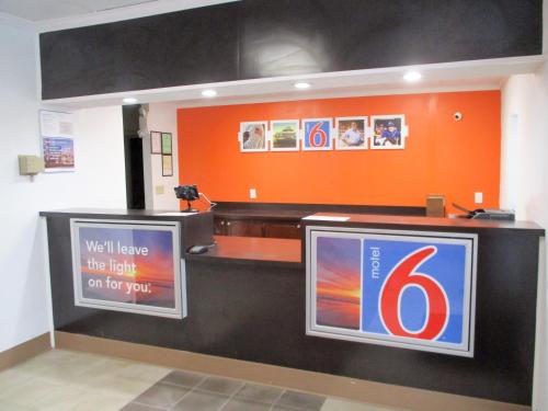 a counter with several different types of drinks on it at Motel 6-Bay Minette, AL in Bay Minette