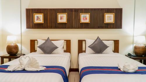 Ένα ή περισσότερα κρεβάτια σε δωμάτιο στο Sunny V Hotel