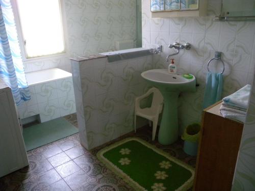 a bathroom with a sink and a toilet and a shower at Apartment Fazana, Istria 13 in Fažana