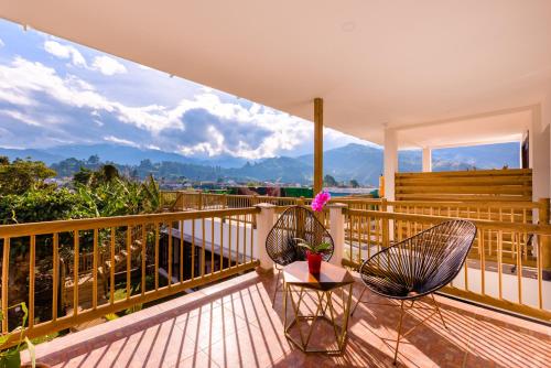 a balcony with two chairs and a table at Terasu Hotel Boutique Salento in Salento