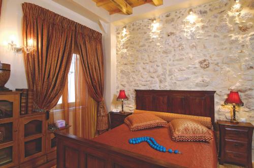 Кровать или кровати в номере Avli Lounge Apartments