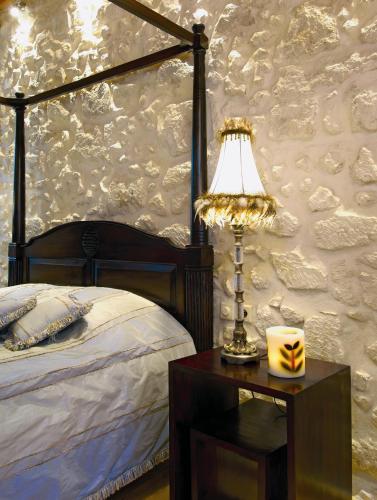 Кровать или кровати в номере Avli Lounge Apartments