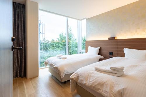 Ένα ή περισσότερα κρεβάτια σε δωμάτιο στο 水晶- Suishou