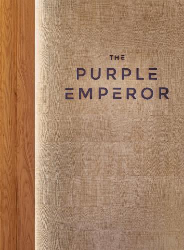 a book that says the purple emperor on the cover at The Den, Bengaluru in Bengaluru