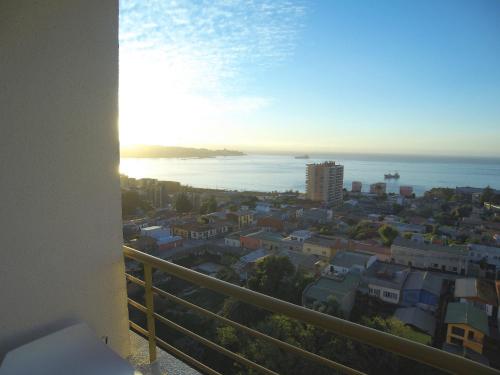 a view of the ocean from a balcony of a city at Alluring View at Valparaiso departamento in Valparaíso