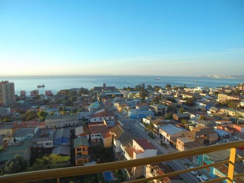 an aerial view of a city with the ocean at Alluring View at Valparaiso departamento in Valparaíso