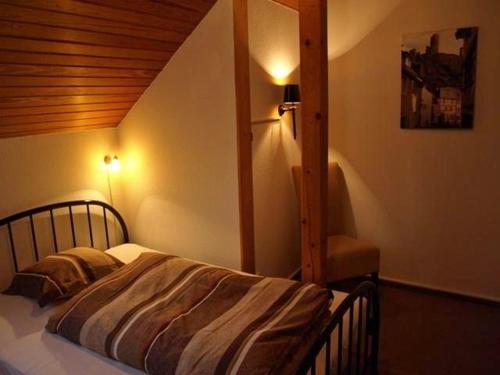 Ένα ή περισσότερα κρεβάτια σε δωμάτιο στο Bed&Breakfast Eifelpension Brückenschenke