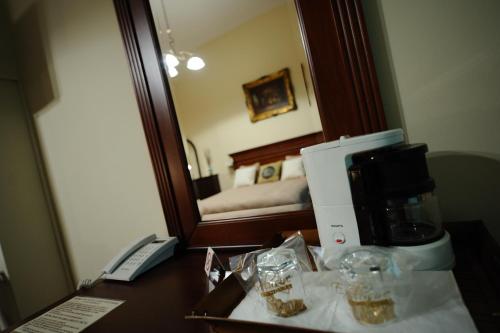 a coffee maker on a desk in a hotel room at Hotel Royal Craiova in Craiova