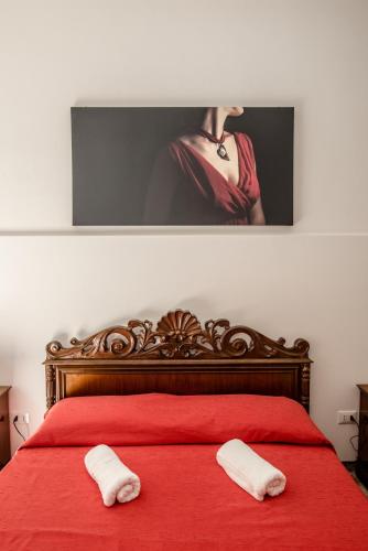 Katil atau katil-katil dalam bilik di Carlentini house B&B