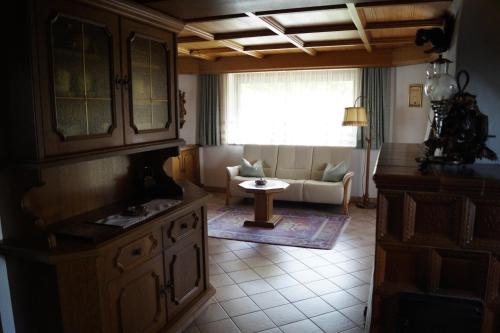 a living room with a couch and a table at FEWO Außerlechner in Innsbruck