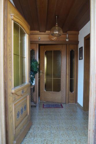 an entry to a home with a wooden door at FEWO Außerlechner in Innsbruck