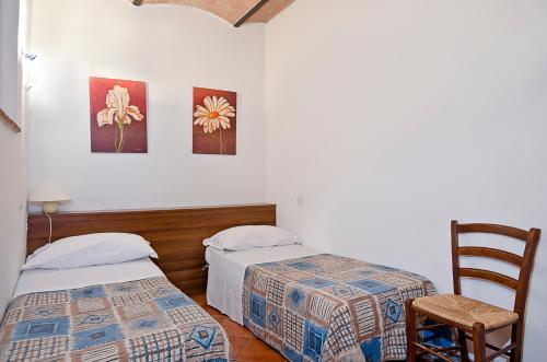 Postel nebo postele na pokoji v ubytování Agriturismo Il Sambuco