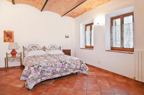 Ένα ή περισσότερα κρεβάτια σε δωμάτιο στο Agriturismo Il Sambuco