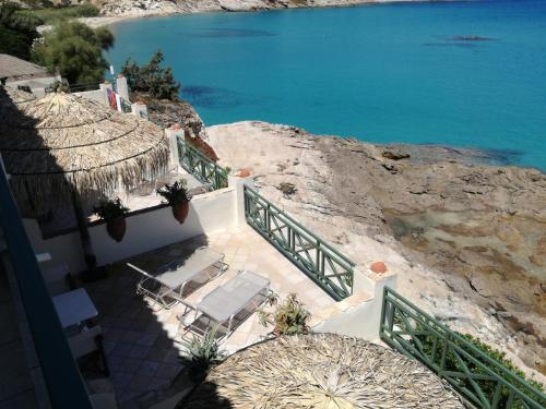 an aerial view of a house with a view of the water at Valeta Studios in Armenistis