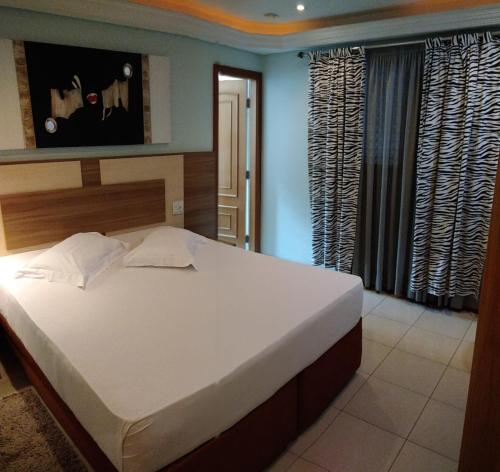 Ліжко або ліжка в номері Hotel Luni