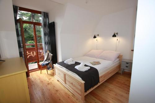 Postel nebo postele na pokoji v ubytování Willa Ubocz