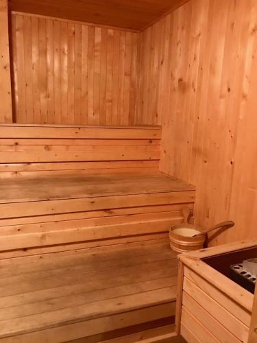 a wooden sauna with a toilet in it at Daf Trans Hotel in Peshtera