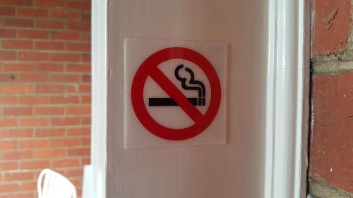 a no smoking sign is posted on a door at Boutique Heritage Studios On Ryrie Geelong CBD Opposite hospital in Geelong