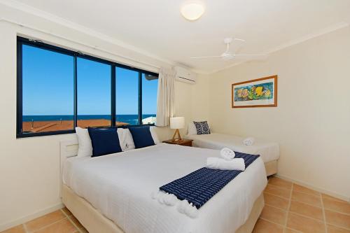 Katil atau katil-katil dalam bilik di The Cove Yamba
