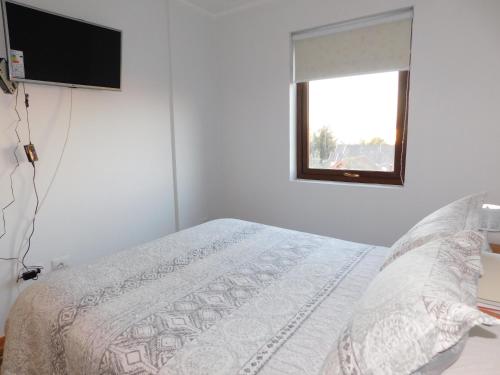 Una cama o camas en una habitación de Los Magnolios