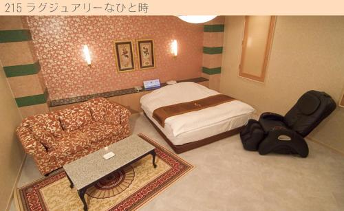 ホテル ベリー松阪(大人専用)にあるベッド