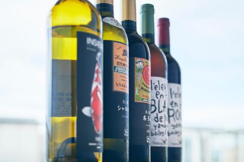 a group of wine bottles sitting next to each other at Shonai Hotel Suiden Terrasse in Tsuruoka