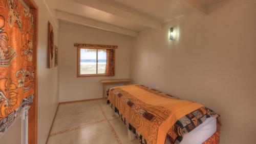 Una cama o camas en una habitación de Tropical Sands
