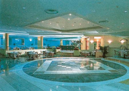 a lobby with a swimming pool in a building at Hotel Club San Diego in Maratea