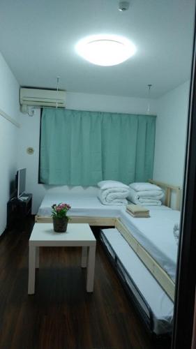 Ένα ή περισσότερα κρεβάτια σε δωμάτιο στο Sophiearth Apartment