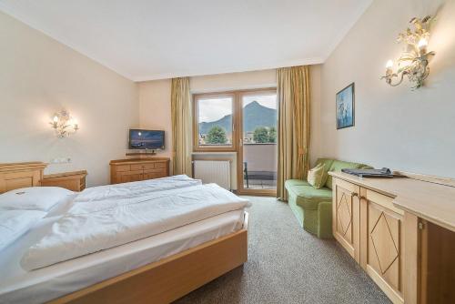 Postel nebo postele na pokoji v ubytování Gasthof Hotel Hauslwirt