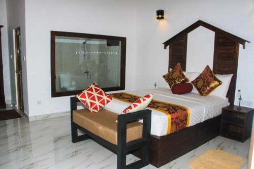 Letto o letti in una camera di Palmyra Nature Resort Sigiriya