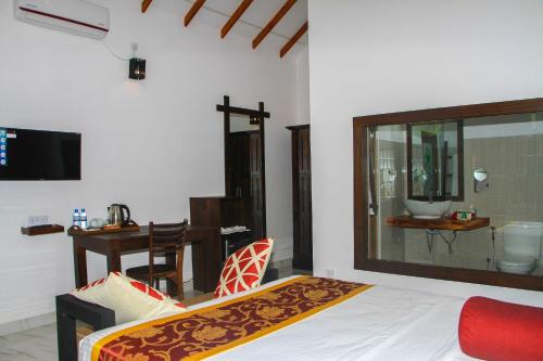TV o dispositivi per l'intrattenimento presso Palmyra Nature Resort Sigiriya