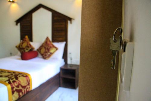 Letto o letti in una camera di Palmyra Nature Resort Sigiriya
