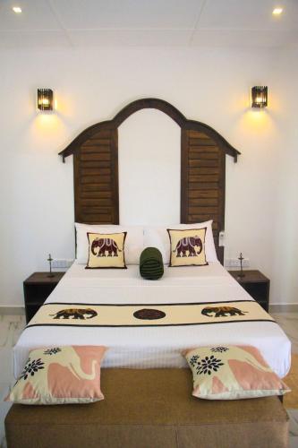 Letto o letti in una camera di Palmyra Nature Resort Sigiriya