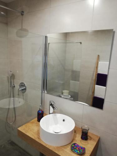 a bathroom with a white sink and a shower at Ocean Sunshine in Órzola