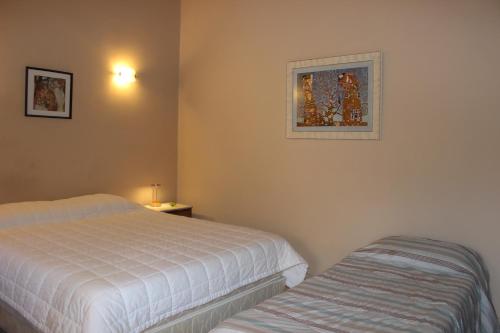 Cama o camas de una habitación en Mandala Apartments