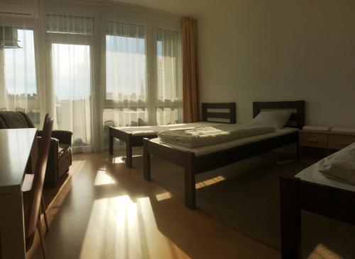 Postel nebo postele na pokoji v ubytování Szelestey utcai apartman (Szombathely)