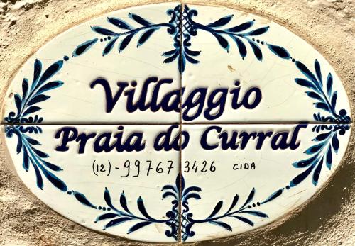 una señal que dice viliaccoaria do civitan en Propriedade a 80 metros da praia do Curral, en Ilhabela