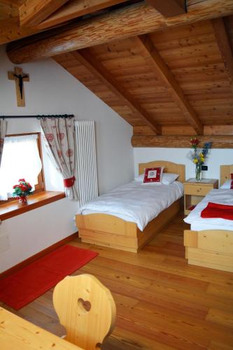 Cama o camas de una habitación en Agritur Dalaip dei Pape
