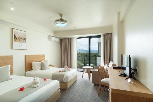Säng eller sängar i ett rum på Nalagi Hotel