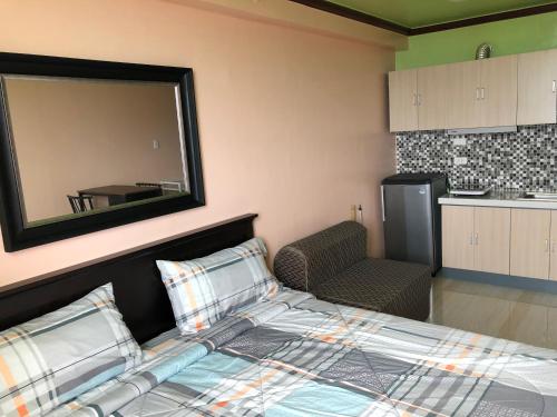 Un ou plusieurs lits dans un hébergement de l'établissement Cebu-Mactan Condo