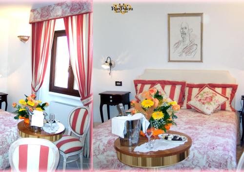 a bedroom with a bed and a table with flowers on it at Masseria Ruri Pulcra in Patù