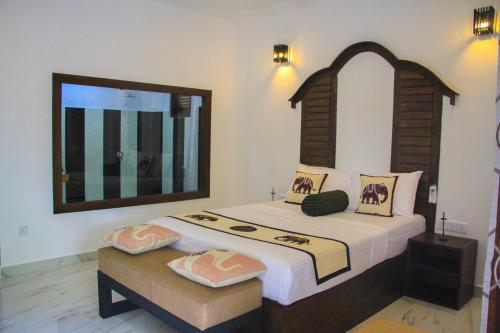 Letto o letti in una camera di Palmyra Nature Resort Sigiriya