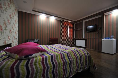 Postel nebo postele na pokoji v ubytování Dkd-bridge Hotel
