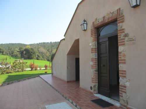 an outside view of a building with a door at Agriturismo Il Felciaione in Massa Marittima