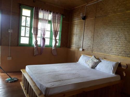 Postel nebo postele na pokoji v ubytování Vamoose Soshing Homestay