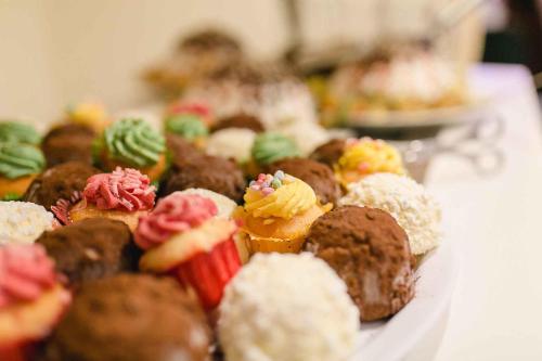 a bunch of different types of pastries on a table at Best Western Plus Hotel Steinsgarten in Gießen