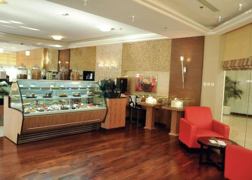 a room with a display case in a store at Gulf Executive Residence in Manama